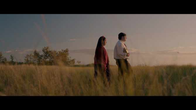 Little Bird movie clip of Tim Myles walking in a field holding an urn alongside Lisa Nasson 