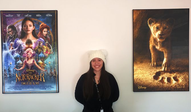 Maria Gabriela Tapia Nieto alongside Disney posters