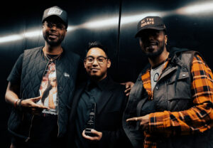 Edward Tuazon with his Best Music Video award at the 2023 TFS Film Fest for Cut Corners – a music video for Toronto hip hop artist, BrYonge.