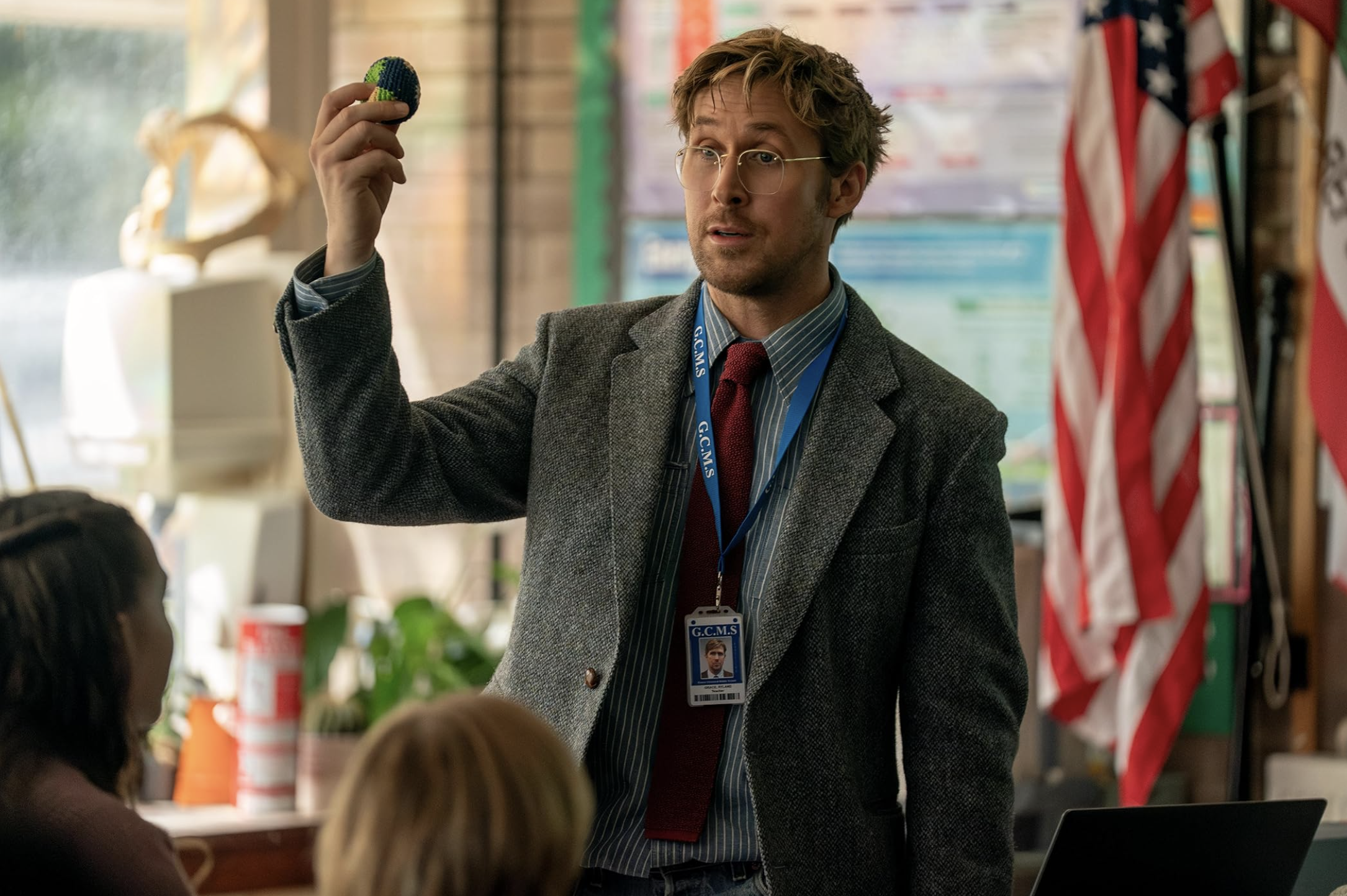 Image of Ryan Gosling in the film Project Hail Mary. Ryan is playing Doctor Ryland Grace, here seen as a teacher in class before the action gets going.